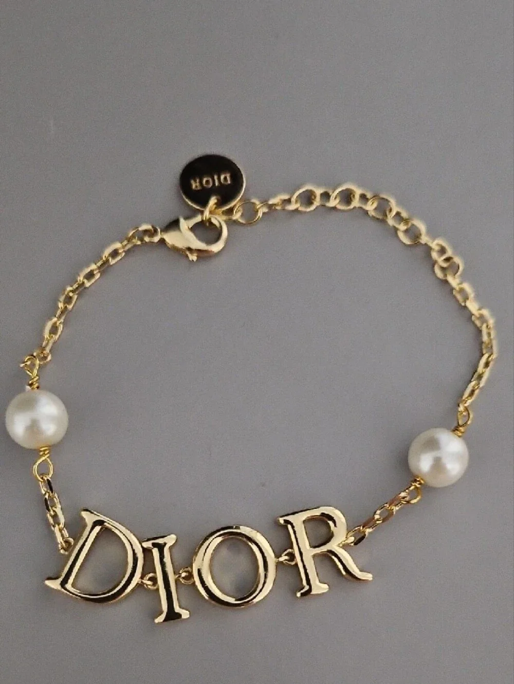 D Letter Gold Tone Logo Bracelet with Pearl Accents